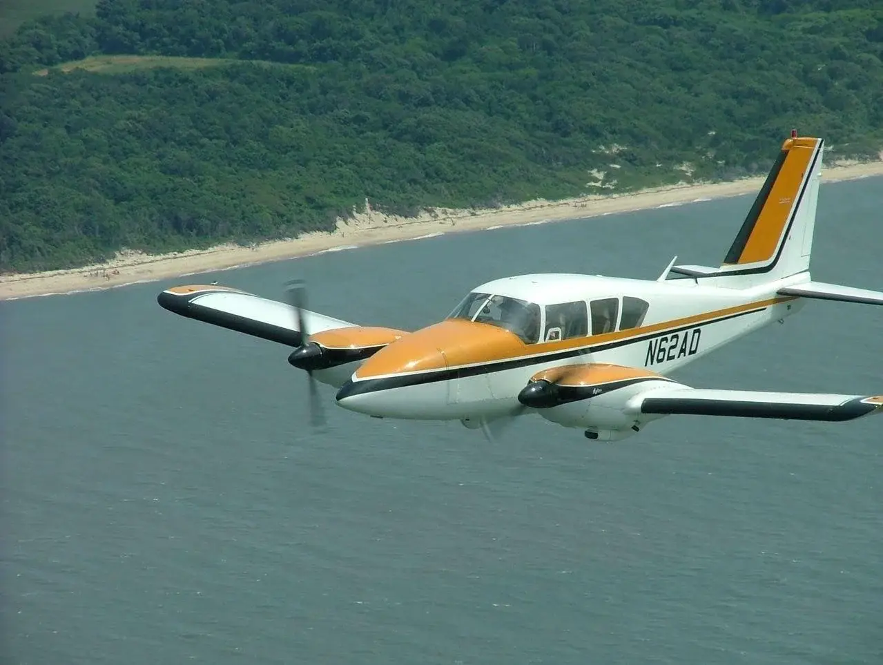 Hawkins Flight Academy Piper Aztec N62AD in flight over Mississippi.