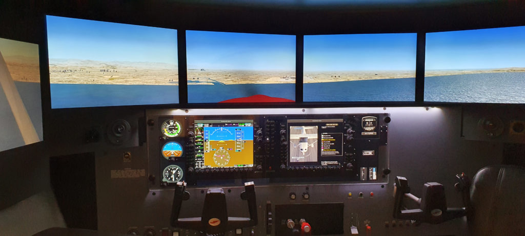 Redbird simulator setup used for aviation training practice at Hawkins Flight Academy