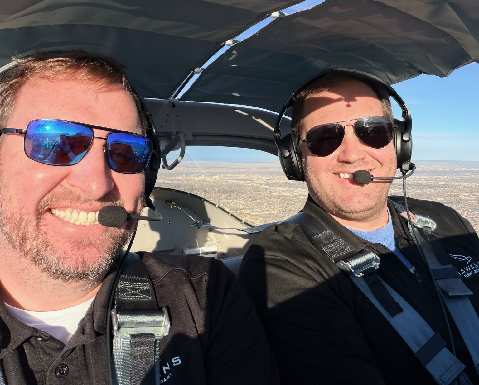 Two pilots in a cockpit during Hawkins Flight Academy cross-country flying
